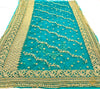 Dark Teal colour netting based heavy embroidery jall all over with beautiful stone work heavy border and embroidered work design on blouse