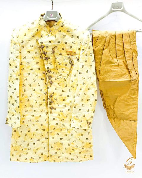 Golden colour brocade print beautifully designed Mens Sherwani with golden tulip pents