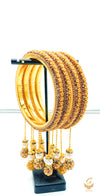 Yellow and Golden Colour Fine Stones Beautiful Brass Bangles Set With Beautiful meenakari & pearl Work Latkans (4 Bangles Set)