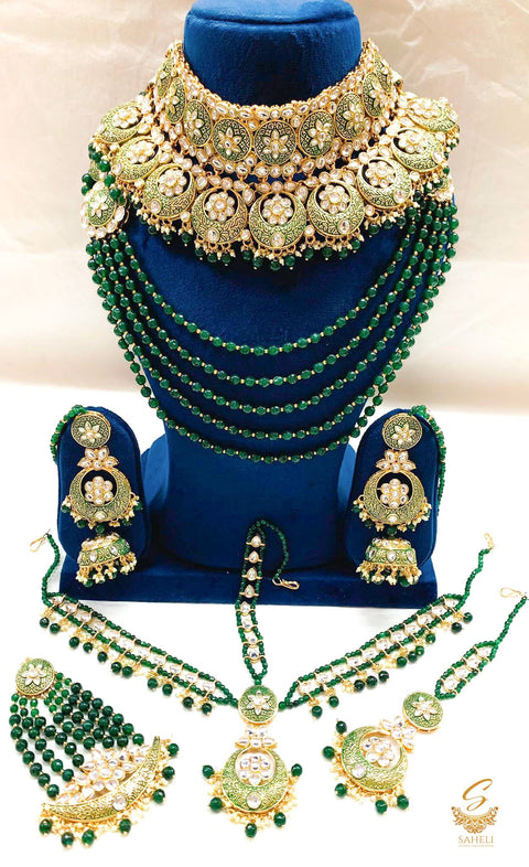 Bottle green colour original meenakari and original kundan work beautiful bridal necklace set with heavy earrings ,tikka , matha patti and 2 hands jwellery , Rani haar , side pasa & nath