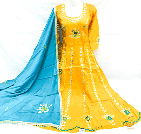 size 40-42 Merigold colour very tassar silk beautiful gotta patti work on front & back anarkali suit with unstitched bottom pents (can be stitched anystyle, we provide stitching) & Pure chinnon full size heavy gotta patti work teal colour dupatta
