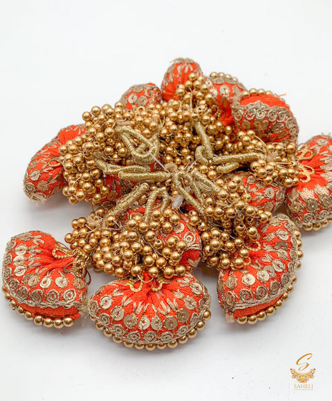 Dark orange colour cushioned latkan with handwork and moti bunch work (PER PAIR)
