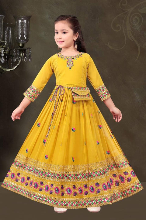 Mustard colour pure georgette based embroidered work girls kameez with embroidered wallet bag