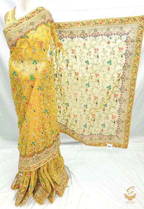 Yellow colour heavy stone work & embroidery jaal work beautiful netting designer saree