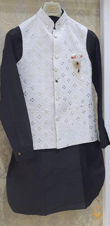 Black colour pure linen based kurta with black pents and georgette based white colour all over embroidery with mirror work jacket