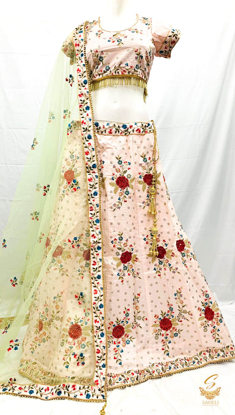 Size 44(upto 48) Pastel pink colour  silk based heavy embroidery & Stone work heavy flared designer Lehnga & stitched blouse with beautiful lace design & heavy work border pastel mint colour netting dupatta