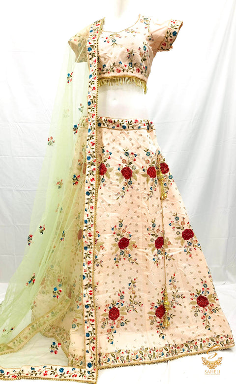 Size 44(upto 48) Pastel rosegold colour  silk based heavy embroidery & Stone work heavy flared designer Lehnga & stitched blouse with beautiful lace design & heavy work border pastel mint colour netting dupatta