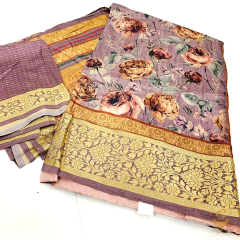 Mauve colour crepe silk based floral print with zari border