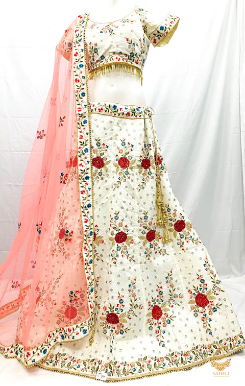 Size 44(upto 48) Golden Cream colour  silk based heavy embroidery & Stone work heavy flared designer Lehnga & stitched blouse with beautiful lace design & heavy work border peachy pink colour netting dupatta