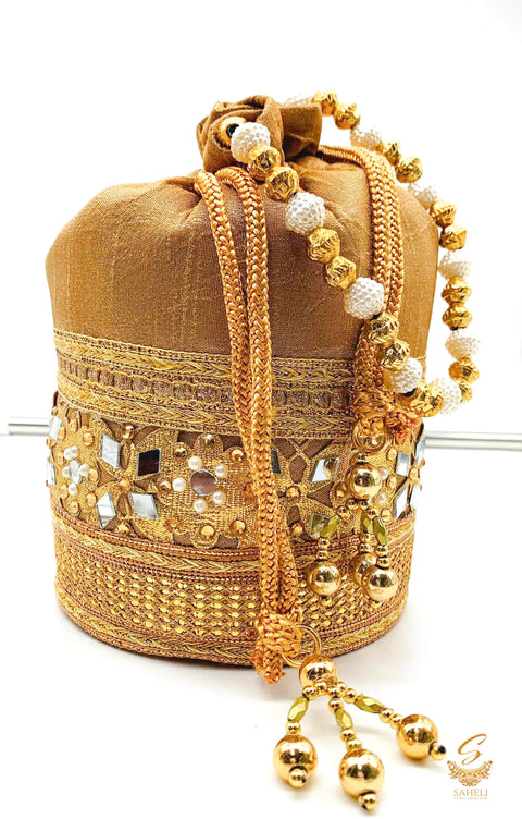 Dark Golden Colour silk Based Mirror Work With Pearl Work Handle Beautiful Potli Bag