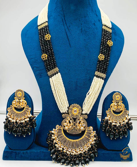 Black colour meenkari with kundan work pendant Long rani haar with pearl work set with beautiful design earrings