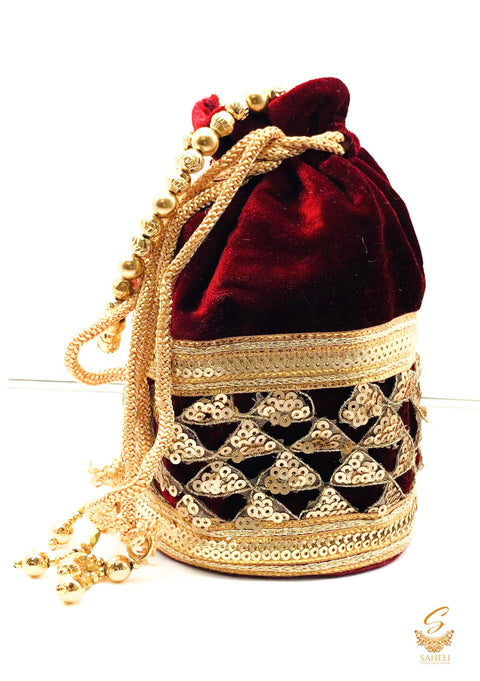 MAroon colour velvet based sequined work with pearl work handle beautiful Potli Bag