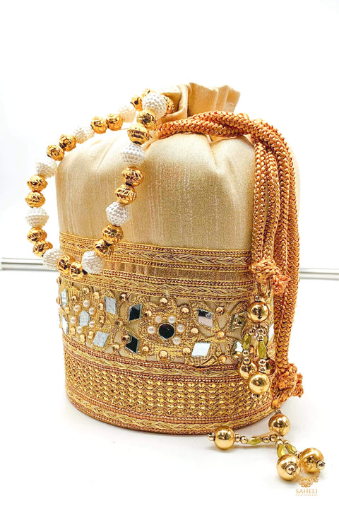 Cream Golden Colour silk Based Mirror Work With Pearl Work Handle Beautiful Potli Bag
