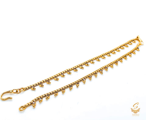 Golden stone work beautiful earring support Sahare